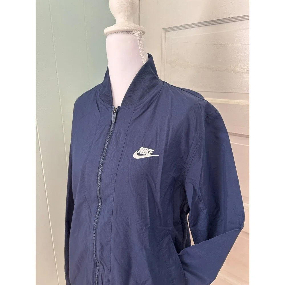 Women's Nike windbreaker rain jacket navy blue pockets Athletic sportswear NWOT